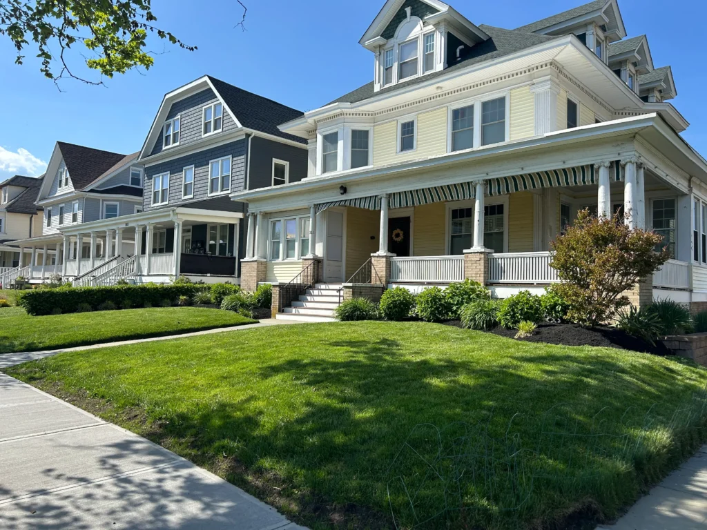 Professional landscaping in Bradley Beach NJ featuring salt tolerant native plantings and a permeable paver system designed for 2026 standard coastal drainage and Jersey Shore storm resilience
